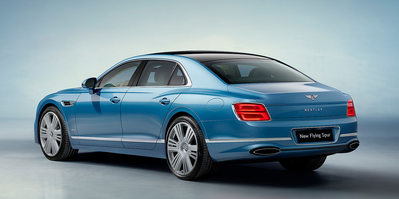 Bentley Melbourne New Bentley Flying Spur Azure sedan rear view in Light windsor blue by Mulliner paint with 22 inch Azure wheels and chrome exterior details