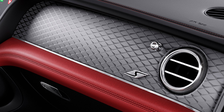 Bentley Melbourne Bentley Bentayga S SUV front interior dash with Dark Tint Diamond Brushed Aluminium veneer and S badge surrounded by Hotspur red and Beluga black hide