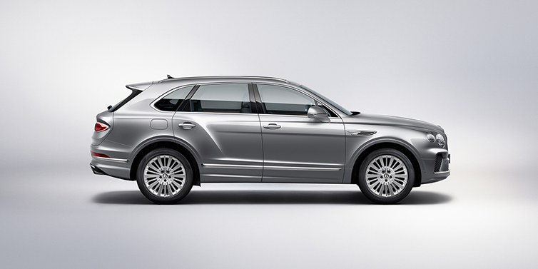 Bentley Melbourne Bentley Bentayga SUV side profile in Moonbeam silver paint against white background featuring 21 inch 5 spoke wheels
