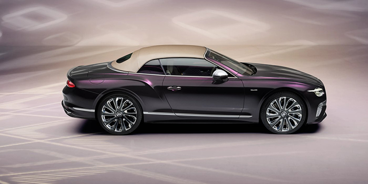 Bentley Melbourne Bentley Continental GTC Mulliner convertible in profile with hood up, in Tanzanite Purple paint and 22 inch Mulliner painted and polished wheels