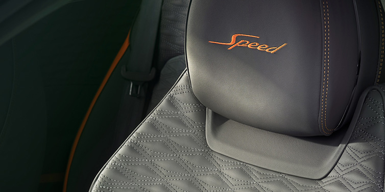 Bentley Melbourne Bentley Continental GT Speed coupe seat detail in Gravity Grey hide and Speed emblem in Mandarin by Mulliner coloured embroidery