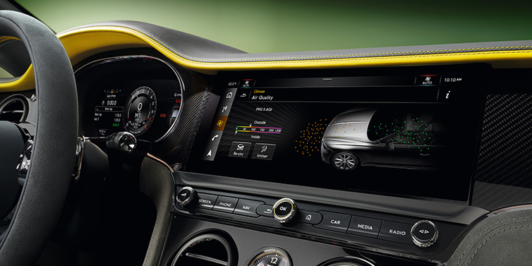 Bentley Melbourne Bentley Continental GTC Speed convertible front interior centre console with MMI screen showing Air Quality visualisation surrounded by Cyber Yellow by Mulliner and Gravity Grey hides and high gloss carbon fibre veneer